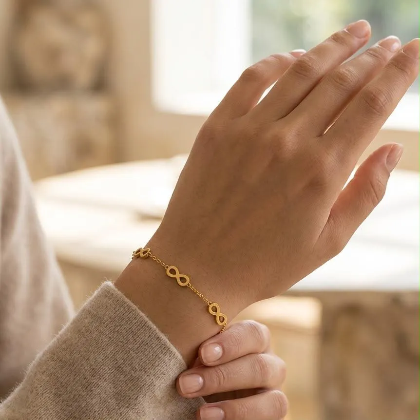Infinity-link chain bracelet on wrist