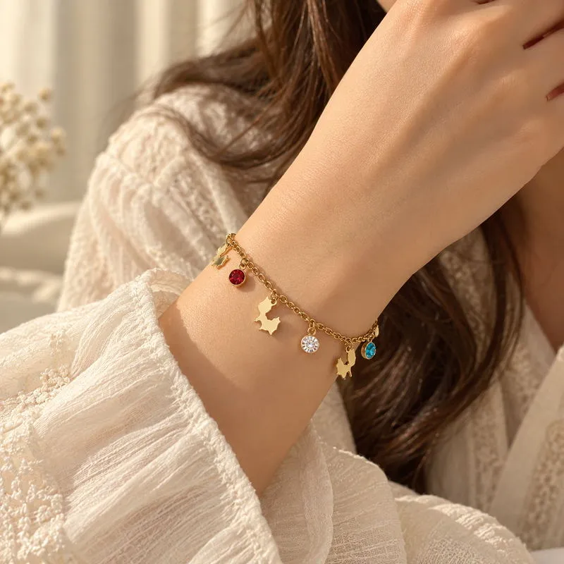 Close-up of the Charmelle bracelet showing Pakistan-shaped charms and colourful accents